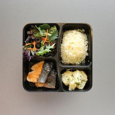 Grilled Salmon, Buttered Rice served with Green Salad & Potato Salad