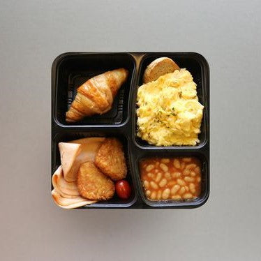 Scrambled Eggs Served with Chicken Ham, Hash Brown, Baked Beans & Croissant
